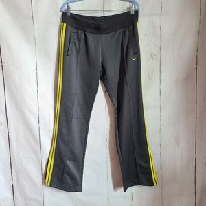 Nike gray and yellow stripe side zip pants large